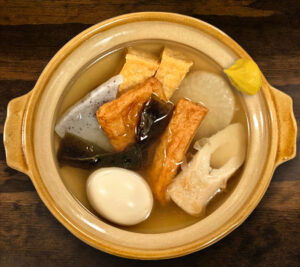egg, daikon, fried tofu, konjac, sh cake, satsuma-age, burdock roll, kombu seaweed in bonito soup, mustard on the side