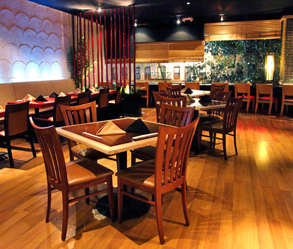 Restaurant inside with a wooden table and chairs