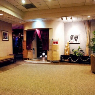 Tranquil entrance to a japanese restaurant with traditional decor area.